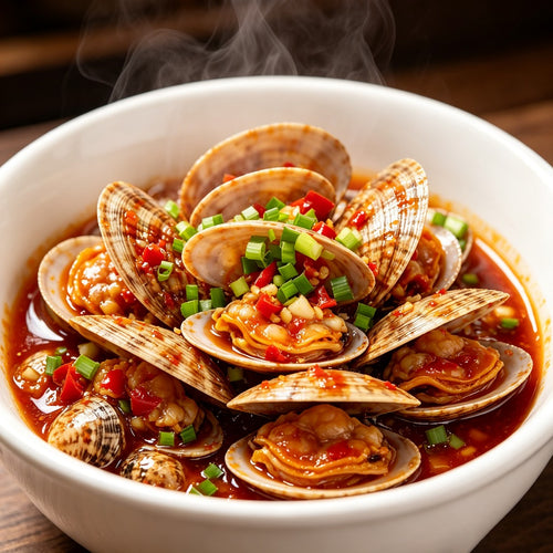 Spicy chilli stir-fried clams in a bowl